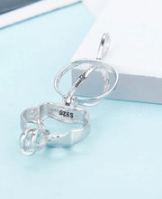 Load image into Gallery viewer, Paw Print Sterling Silver Cage Pendant