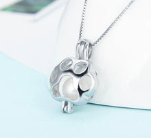 Load image into Gallery viewer, Paw Print Sterling Silver Cage Pendant
