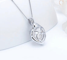 Load image into Gallery viewer, Mother and Child Sterling Silver Cage Pendant
